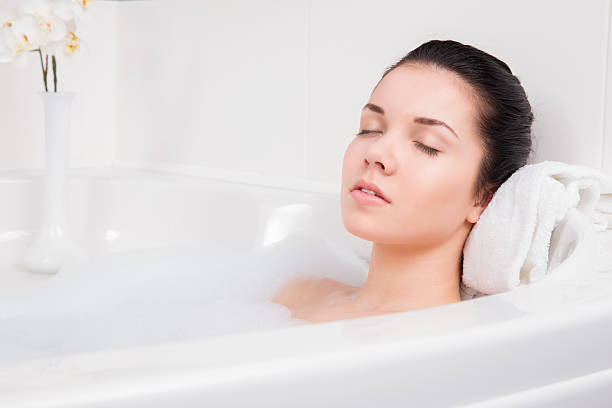 istock beautiful woman takes bubble bath 458049327
