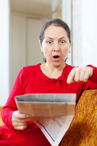 wonder mature woman with newspaper