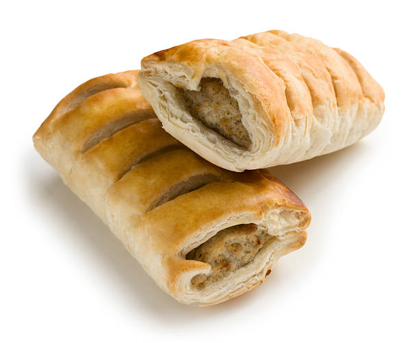 istock Sausage rolls pastry snacks with meat on a white background 458060301