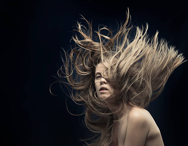 istock young beautiful women with flying hair 458060809