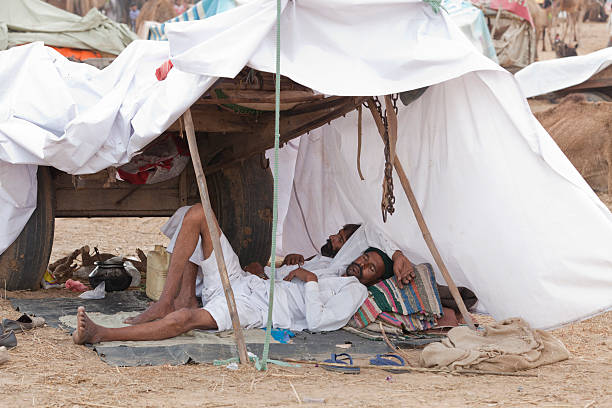 camel fair - shoe men indian culture indian ethnicity stock-fotos und bilder