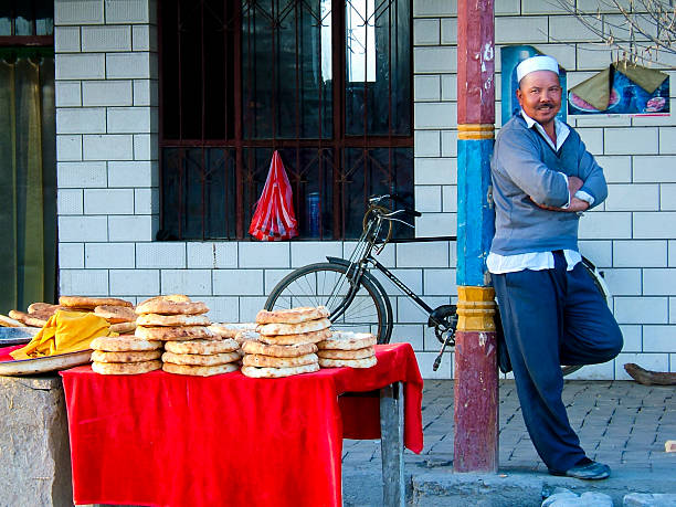 uyghur minority in xinjiang, china - urumqi stockfoto's en -beelden