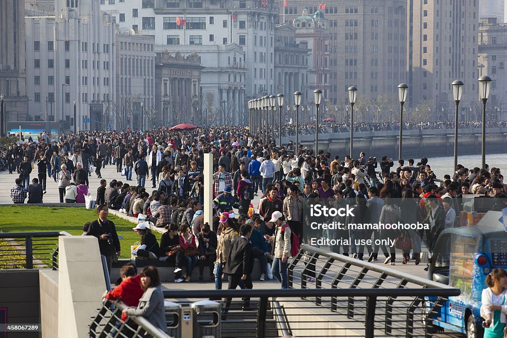 shanghai: the bund "Shanghai, China - April 3, 2012: the bund, one of the most popular tourists attractions in shanghai, is swarmed with visitors during the qingming national holiday." Asia Stock Photo