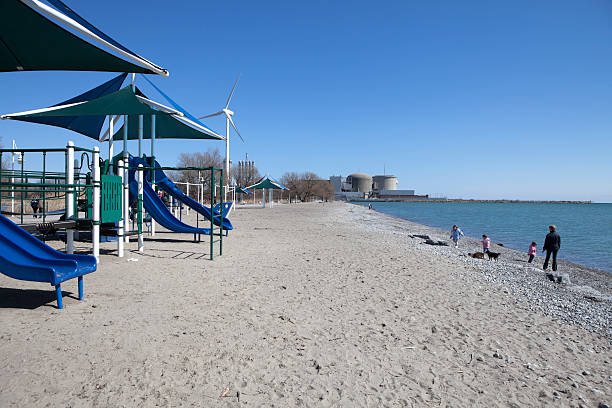 playground sulla spiaggia - nuclear power station nuclear energy child nuclear reactor foto e immagini stock