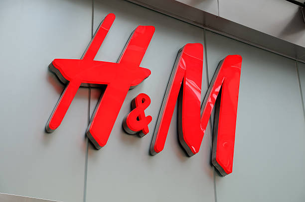 H&amp;M sign "Hong Kong, China - June 5, 2011: H+M sign in Hong Kong. H+M is a Swedish retail-clothing company" h and m stock pictures, royalty-free photos & images