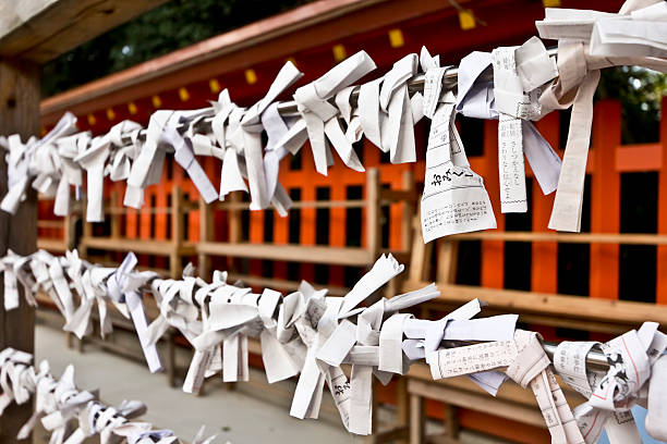 Fortune Slips Tied at a Japanese Shrine stock photo