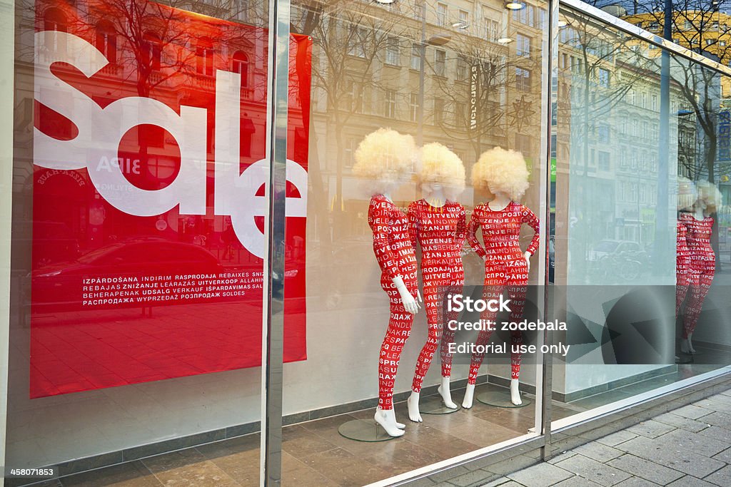 Sales at Clothes Store "Vienna, Austria - January 6, 2012: Mannequin on a shopping window of a clothes store during the sales period along Mariahilfer Strasse." Clothing Store Stock Photo