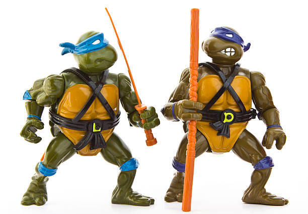 Teenage Mutant Ninja Turtles - Figurines "Gothenburg, Sweden - May 21, 2011: An isolated studio shot of two old action figures based on the Teenage Mutant Ninja Turtles franchise." action figure photos stock pictures, royalty-free photos & images