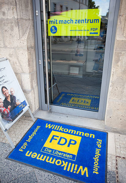 FDP party center "Berlin, Germany - July 7, 2011: FDP headquarters in Berlin. The FDP is a liberal political party in Germany and has been part of governmental coalitions during most parts of the German Bundesrepublik. Entry door to the national headquarters and the ""Mitmach Zentrum"" for public involvement." german free democratic party photos stock pictures, royalty-free photos & images