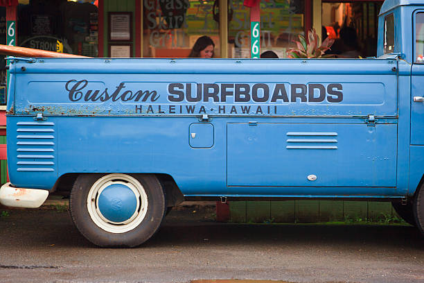 Haleiwa Surfboards "Haleiwa, United States, March3, 2011. Volkswagon Van and Surfboard parked at Haleiwa, Hawaii." north shore stock pictures, royalty-free photos & images