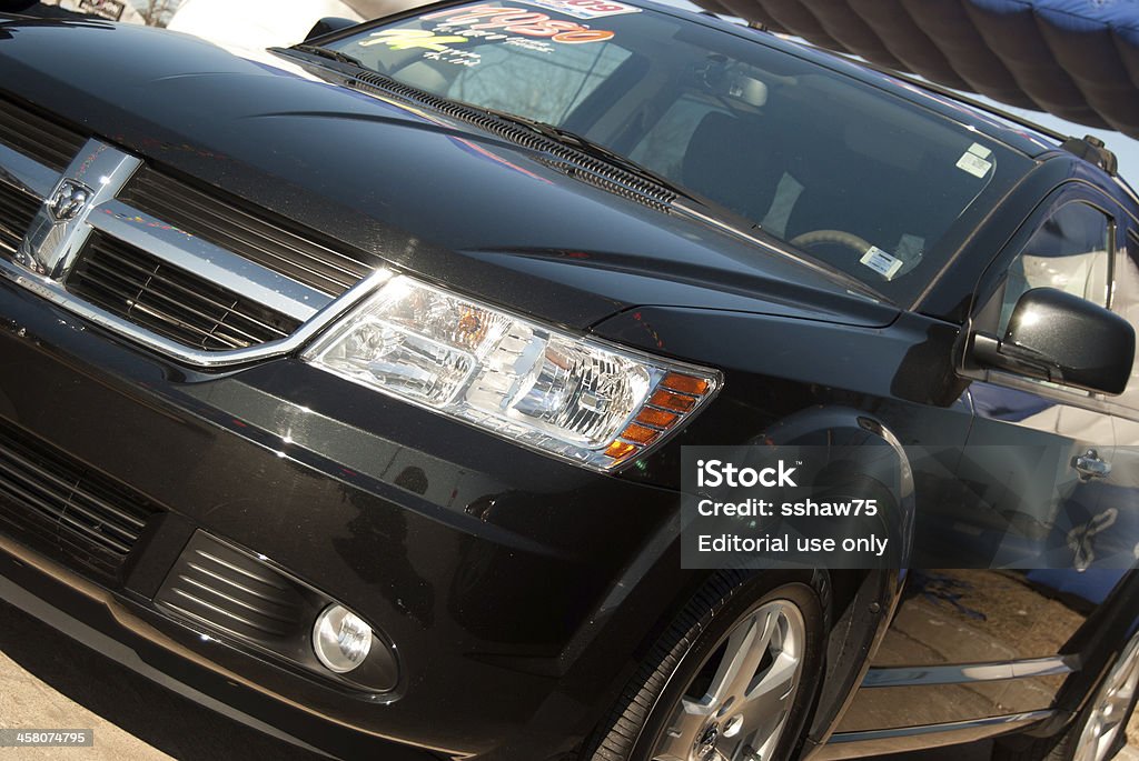 Black 2009 Dodge Caliber Hatchback at Dealership "Halifax, Nova Scotia Canada - March 27, 2011: A Black 2009 Dodge Caliber Hatchback on the sales lot at Dodge Dealership in Halifax, Nova Scotia, Canada.  The year, price, and financiing information can be seen on the windshield in brightly colored signs.  The Dodge Caliber was first released in the 2007 model year lineup.  It is classified as a crossover vehicle by dodge." 2009 Stock Photo