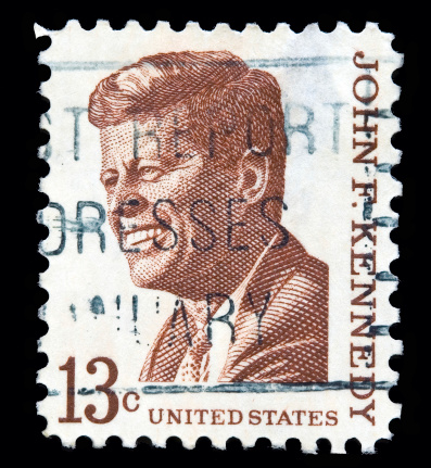 Varese, Italy - July 23, 2011: USA 13 cent postal stamp representing John F. Kennedy