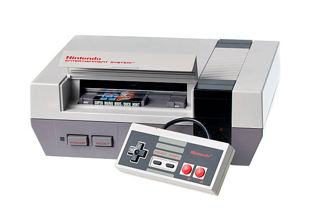 nintendo-entertainment-system mit controller und spiel - nes stock-fotos und bilder