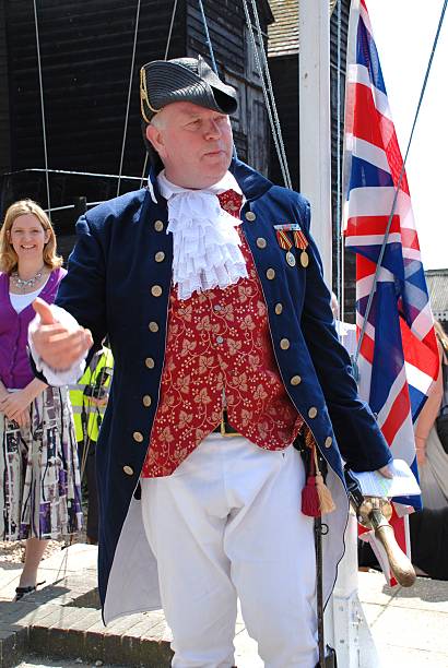 Town Crier, Hastings "Hastings, England - July 30, 2011: Nick Lynas, Old Town Crier, speaks at the launch of Old Town Carnival Week. The carnival was founded in 1968." town criers stock pictures, royalty-free photos & images