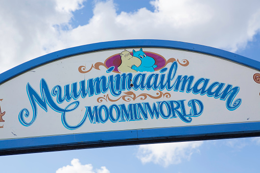 Naantali, Finland - July 24, 2011: Sign at the entrance to Moominworld in Naantali, Finland. Moomin world is a theme park and a popular tourist destination for families, where children can meet the characters from the Moomin books by Tove Jansson.