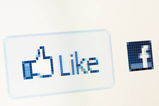 Borgosesia, Italy - June 26, 2011: Facebook like button macro close-up on RGB monitor. The \
