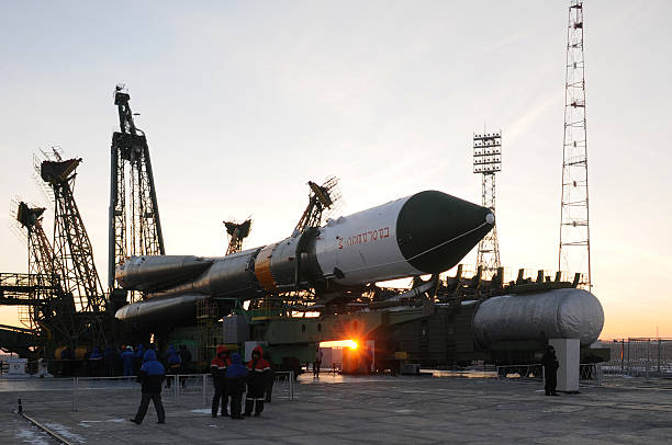 Progress Cargo Spacecraft Elevation "Baikonur, Kazakhstan - January 26, 2011: Progress cargo spacecraft is being elevated on the launch tower at sunrise." launch tower stock pictures, royalty-free photos & images