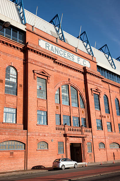 Ibrox Stadium, Glasgow Glasgow, UK - January 12, 2012: The Rangers F.C. sign over the entrance to the Bill Struth Main Stand at Ibrox Stadium, Glasgow, the home ground of Rangers Football Club. The main stand was built in 1928 with an impressive red brick facade. ibrox stock pictures, royalty-free photos & images