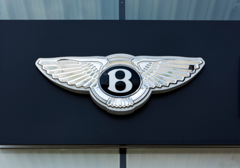 Dusseldorf, Germany - June 12, 2011: Bentley logo on the outside of car dealer's building. Bentley is a british luxury car manufacturer based in Crewe, England and belongs to Volkswagen AG.