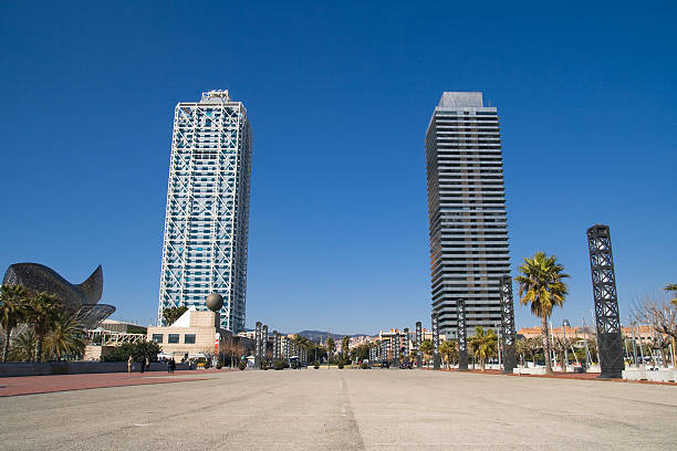 Barcelona, Spain - February 11, 2012: The Hotel Arts and the Mapfre tower on February 11, 2012 in Barcelona, Spain. Hotel Arts, on the left, is a luxurious five stars hotel designed by Bruce Graham. On the right, the Mapfre tower is an office building designed by Iñigo Ortiz and Enrique León. Both buildings were inaugurated in 1992 and are still the tallest skyscrapers of Barcelona with 154 meters high.