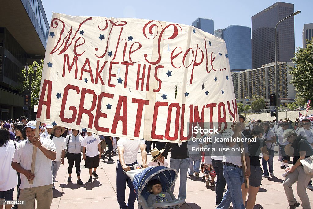 Immigration march in Los Angeles "Los Angeles, California, USA - May 1st 2010: On International Workers Day, people marching in Downtown on support to Arizona immigrants and demand an immigration reform." Change Stock Photo