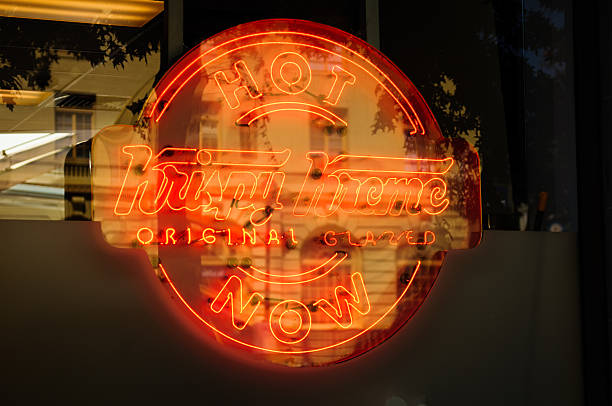 Krispy Kreme Sign With Building Reflection stock photo