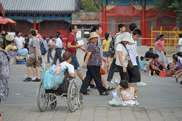 Beging Forbidden City "Beijing, China - August 1, 2010: Passing tourist looking at two beggars Forbidden City" forbidden city beijing architecture chinese ethnicity stock pictures, royalty-free photos & images