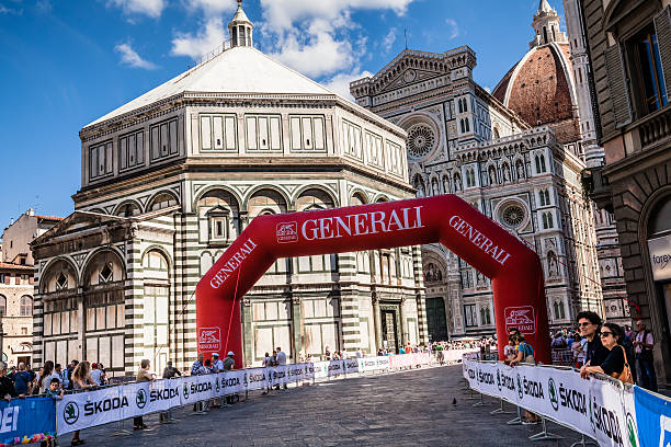 2013 UCI Road World Championships in Florence, Italy Florence, Italy - September 22, 2013: The Piazza del Duomo of Florence (Tuscany, Italy) in the first day of the 2013 UCI Road World Championships. The route of the race through the historic center of the city, passing the famous square with the cathedral and baptistery. uci road world championships stock pictures, royalty-free photos & images