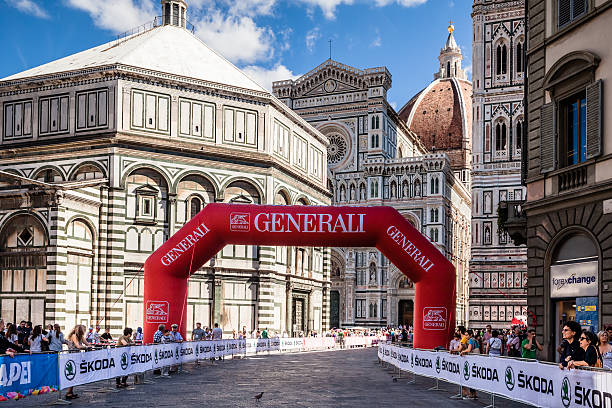 2013 UCI Road World Championships, Florence Piazza del Duomo Florence, Italy - September 22, 2013: The Piazza del Duomo of Florence (Tuscany, Italy) in the first day of the 2013 UCI Road World Championships. The route of the race through the historic center of the city, passing the famous square with the cathedral and baptistery. uci road world championships stock pictures, royalty-free photos & images