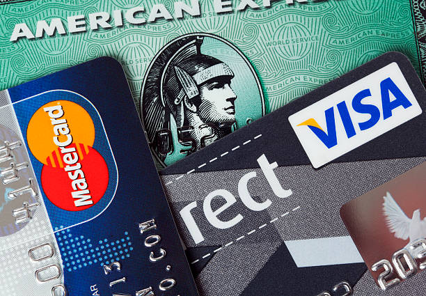 major credit cards "Ratingen, Germany - June 21, 2011: Closeup studio shot of credit cards issued by the three major brands American Express, VISA and MasterCard." american express stock pictures, royalty-free photos & images