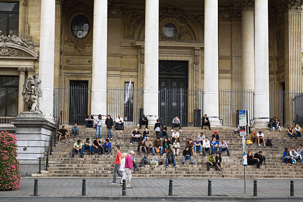 Brussels, Belgium - June 11, 2013: Busy street in Brussels with a metro station in the foreground. 