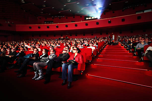 People in 3d-glasses watches film. stock photo