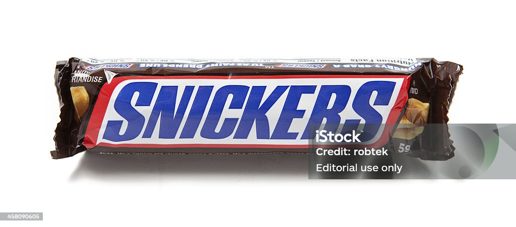 Snickers Chocolate Candy Bar "Toronto, Canada - May 8, 2012: This is a studio shot of a Snickers candy bar made by Mars, Incorporated isolated on a white background." Snickers Stock Photo