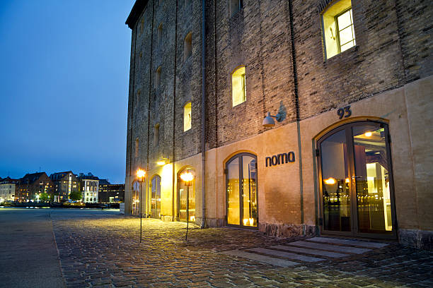 Restaurant Noma Copenhagen, Denmark - September 17, 2011: The danish gourmet restaurant Noma opened in 2003. It is situated in an old warehouse in Christianshavn, Copenhagen. In 2005 it received its first Michelin Star and the second in 2007. book title stock pictures, royalty-free photos & images