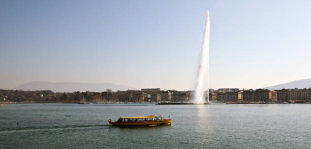 scenic landscape with rowing boat on the background of the Alps on the Lake Geneva, Switzerland