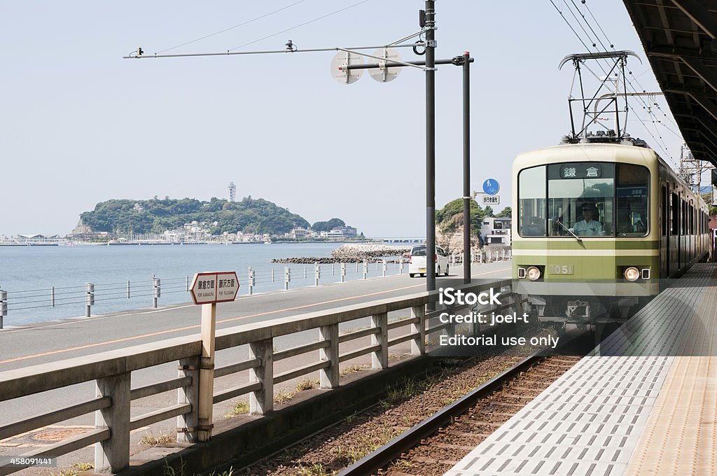 Enoden "Kamakura, Kanagawa, Japan - September 7, 2011: A train of the Enoshima Electric Railway (or Enoden) is arriving at Kamakura-Koko-Mae Station. The train line travels 10 km (6.2 miles) between Kamakura and Fujisawa in Kanagawa, Japan." Kamakura City Stock Photo