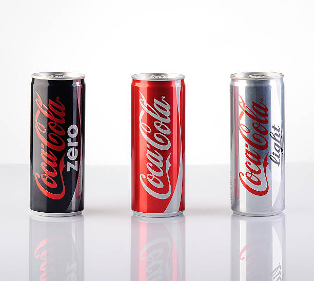 Group of 200ml Coca-Cola Cans "Astanbul, Turkey - July 31, 2013: Coca-Cola 200ml products on white background with reflections. Include Cola-Cola Zero and Coca-Cola Light" coke zero photos stock pictures, royalty-free photos & images