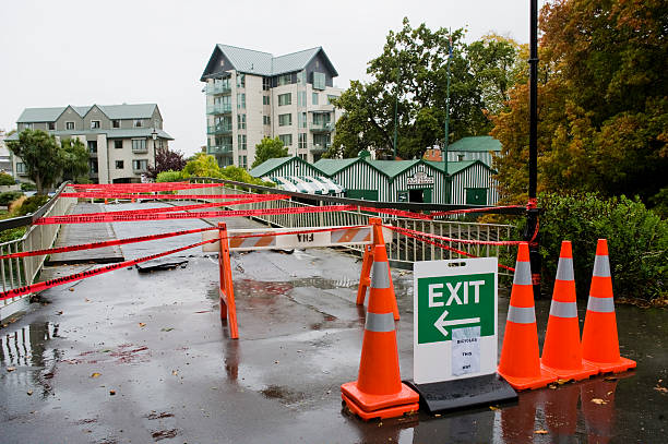 Damage After the Christchurch Earthquake in February 2011 "Christchurch, New Zealand - April 4, 2011: Bridge area sectioned off with cones in Christchurch after the earthquake which struck on 22nd February 2011." christchurch earthquake stock pictures, royalty-free photos & images