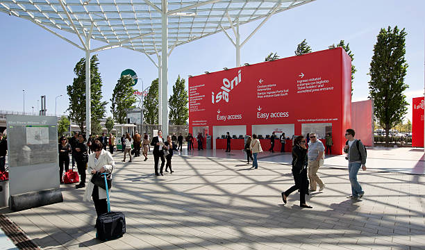 Salone del Mobile, international furnishing and accessories exhibition "Milan, Italy - April, 13th 2011: People enter Salone del Mobile, international furnishing and accessories exhibition, at Milan Fair building." fiera stock pictures, royalty-free photos & images