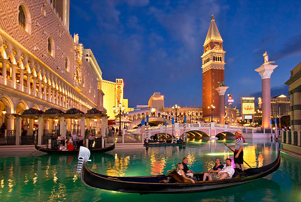 Las Vegas, USA - June 15, 2012: people enjoy the Venetian Resort Hotel & Casino. It opened on May 3, 1999 with flutter of white doves, sounding trumpets, singing gondoliers and actress Sophia Loren.