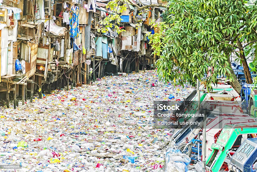 River of garbage "Manila, Philippines - January 6,2008: A river of garbage clogs a creek in Manila. Poverty and garbage disposal are major problems in the Philippines." Concepts Stock Photo