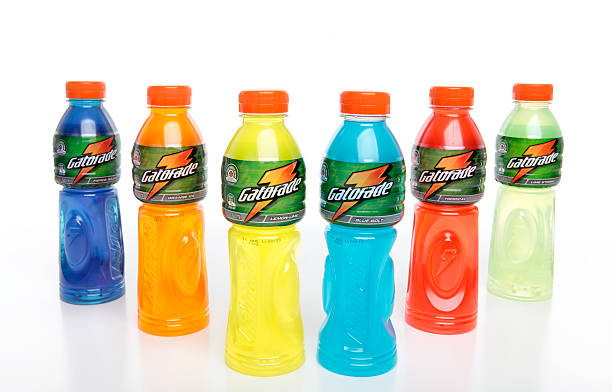 Gatorade - Energy Sports Drinks "Penrith, Australia - February 10, 2011:  Bottles of Gatorade sport isotonic drinks on a studio white background.  Varieties shown from left to right are, Fierce Grape, Orange Ice, Lemon-Lime, Blue Bolt, Tropical, Lime Storm" quench your thirst pictures stock pictures, royalty-free photos & images