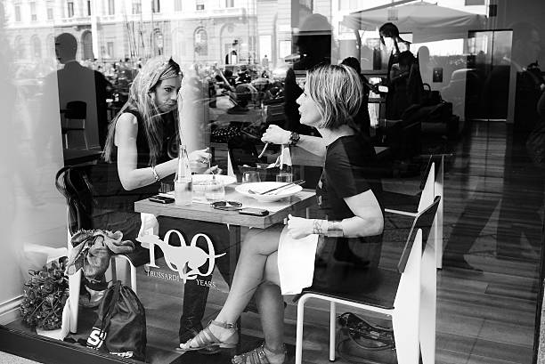 two women having lunch in Milan stock photo