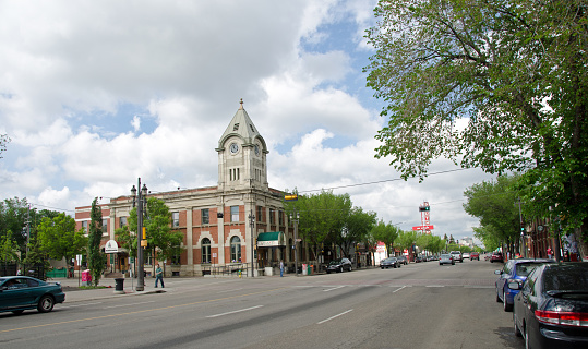 Edmonton, Canada - June 5, 2011: Looking east down Whyte Avenue in the Old Strathcona region in Edmonton Alberta.The building is the old post office and is now a restaurant.  This avenue runs into the Alberta University district and it as a popular street for student shopping and entertainment.