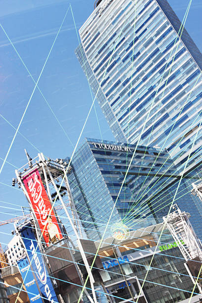 STAPLES Center Los Angeles Sports Entertainment "Los Angeles, California, USA - August 24, 2013:  Mirrored reverse abstract of the STAPLES Center in downtown Los Angeles.  The STAPLES Center is a sports and entertainment venue.  It is home of four professional sports franchises aa the NBA Los Angeles Lakers, Los Angeles Clippers, the NHL Los Angeles Kings and the WNBA Los Angeles Sparks.  The AEG owned and operated arena at the center hosts high-profile events such as the 2004 and 2011 NBA All-Star Game, the 2002 NHL All-Star Game, the 2000 Democratic National Convention and 2009 World Figure Skating Championships, twelve GRAMMY Award shows as well as the annual X-Games competitions and regular concerts by big-named artists.  Corporate marketing abounds throughout the center - represented in this image by Coca Cola, Wells Fargo, Nokia, Wolfgang Puck Bar and Grille, Marriott, Herbalife, Budweiser, AXS.TV, Ritz-Carlton, the city of L.A. and of course Staples." los angeles kings stock pictures, royalty-free photos & images