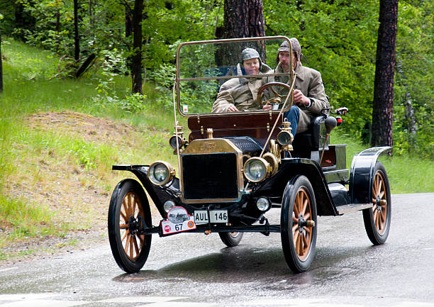 Fort T from 1914 "Stockholm, Sweden - june 03,2012: A couple driving an old fully restored T-Fort Cap from 1914 , in a classic car cavalcade around the small island Djurgarden on public road in Stockholm Sweden" model t ford stock pictures, royalty-free photos & images