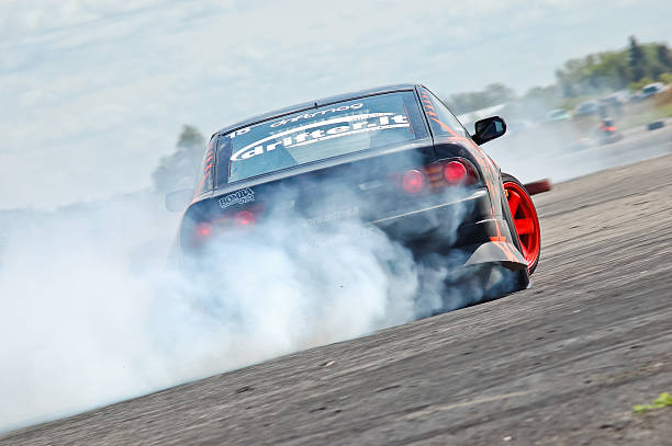 Nissan 200sx RPS13 drifting "Kedainiai, Lithuania - May 9, 2009: Drift parctise event at Kedainiai drift track (abandoned air field) where anybody had opportunity to improve their drifting skills.. Here is Nissan RPS13 skidding with lots of smoke in a high speed U turn." snowdrift stock pictures, royalty-free photos & images