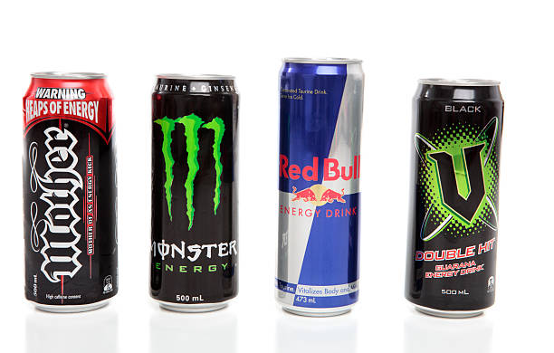 Cans of Energy Drinks "Penrith, Australia  - February 5, 2011:  Cans of carbonated energy drinks which include from Left to Right, Mother, Monster, Red Bull, and V.  White background." quench your thirst pictures stock pictures, royalty-free photos & images