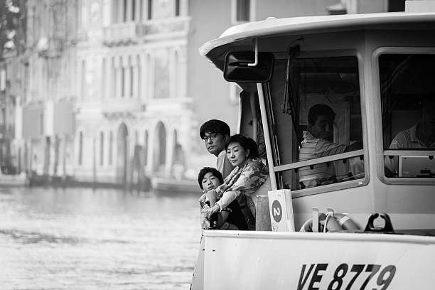 Venice,Italy. 28.10. 2022. View of Grand Canal with Rialto Bridge and gondoliers in Venice, Italy. Landscape with Rialto Bridge and gondola on Grand Canal in Venice