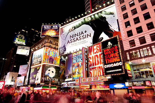 Broadway at Times Square by Night "New York, USA - Nov. 26 2009: Busy street scene on Broadway, Times Square by night in New York City." 42nd street photos stock pictures, royalty-free photos & images